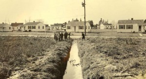 Raw sewage ran in open ditches as children played in Portsmouth's Simonsdale neighborhood in 1944, documenting the need for construction of a sanitary sewer system.