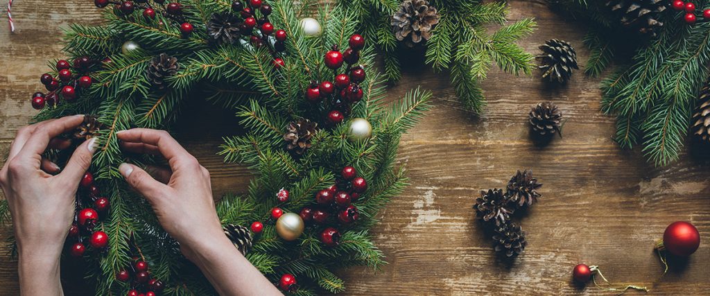 woman making wreath