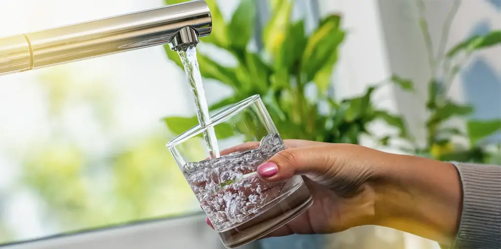 Filling water up at the tap Filling water up at the tap